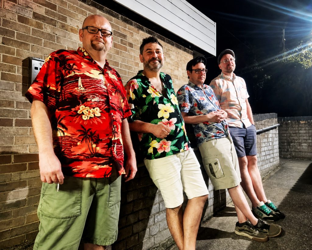 Hot Fat standing outside Acle Sports and Social Club for a promo-shoot